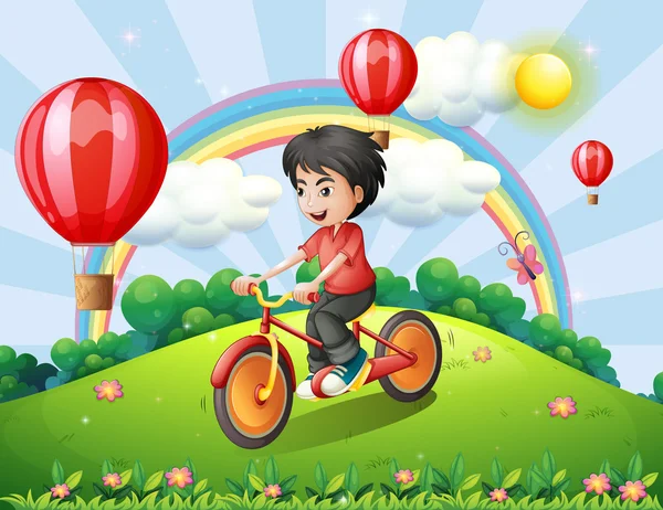 Een jongen fietsen op de heuveltop met een regenboog en zwevende ballonnen — Stockvector