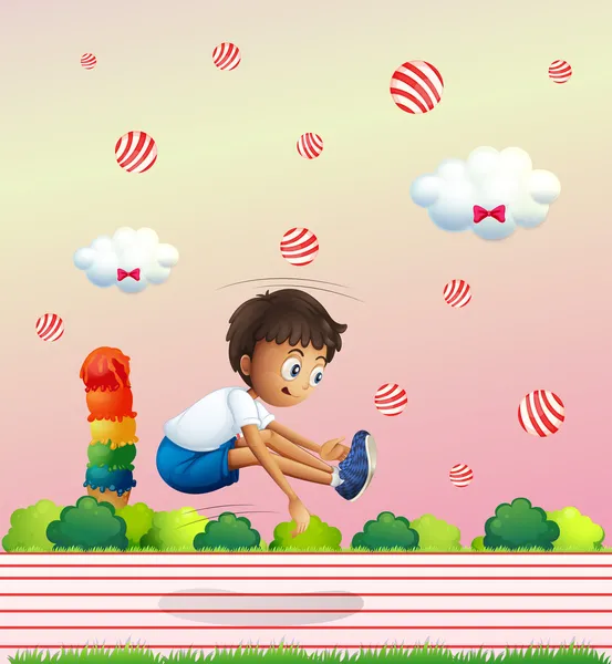 A boy exercising in the candyland — Stock Vector