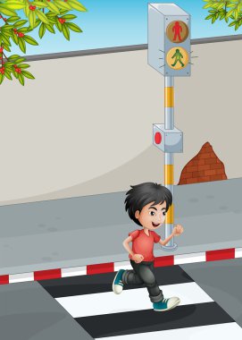 karşıdan karşıya geçerken çalışan bir çocuk