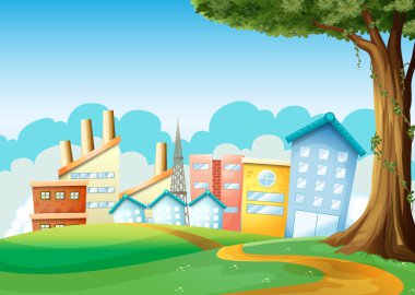 Fabrika ve tepeler arasında yüksek binalar