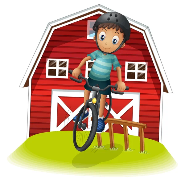 Um menino brincando com sua bicicleta na frente do celeiro — Vetor de Stock