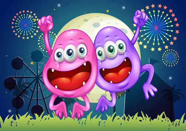 Dos monstruos felices en el parque de atracciones — Vector de stock