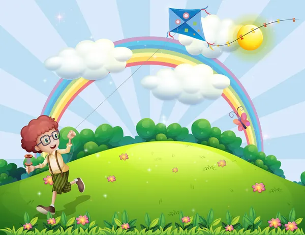 Een jongen speelt met zijn vlieger op de heuveltop met een regenboog — Stockvector