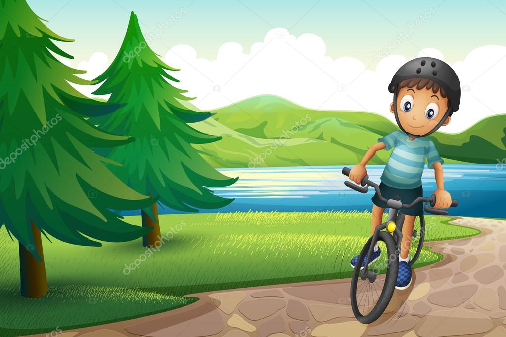 A boy biking near the pine trees at the riverside