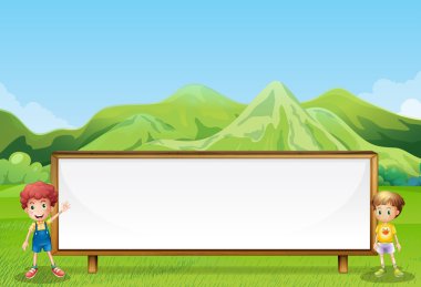 büyük boş bir tabela alan iki çocuk ile