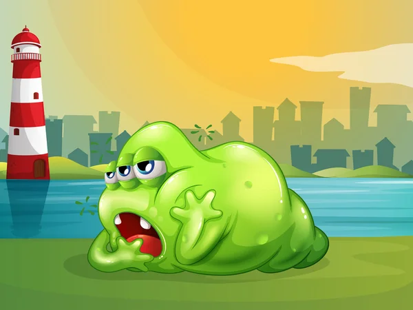Un monstru gras verde peste far — Vector de stoc