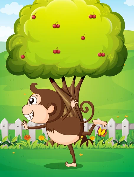 A monkey in front of the tree in the yard — Stock Vector