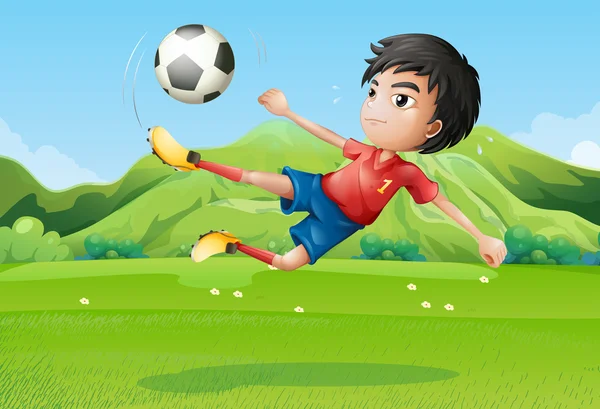 A young boy playing football at the field — Stock Vector