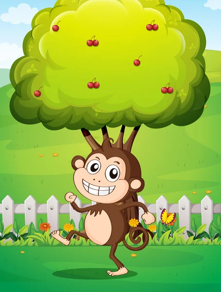 A smiling young monkey near the fence with a tree — Stock Vector