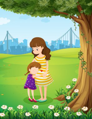 Anne ve kızı ağacının altında