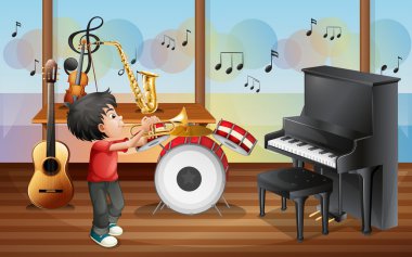 müzik aletleri ile bir çocuk