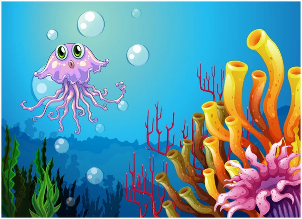 An octopus and the coral reefs under the sea — Stock Vector