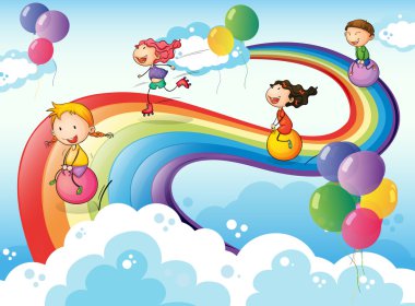 A group of kids playing at the sky with a rainbow
