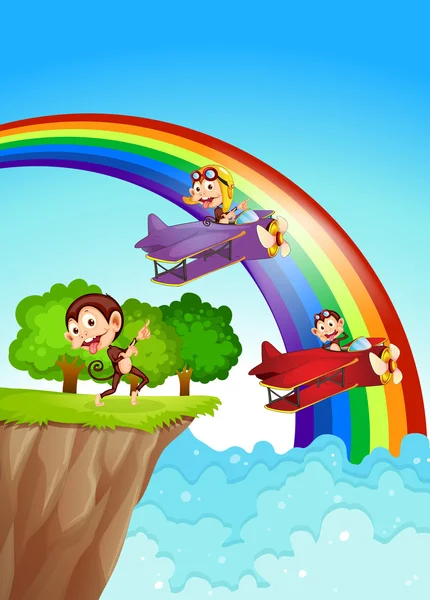 Playful monkeys at the cliff with a rainbow — Stock Vector