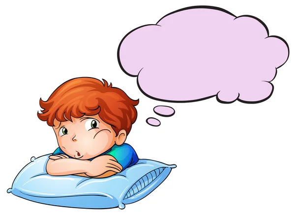 A young boy leaning over the pillow with an empty callout — Stock Vector