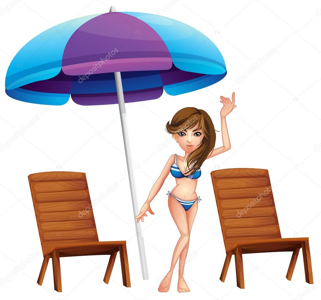 A pretty girl at the beach near the wooden chairs