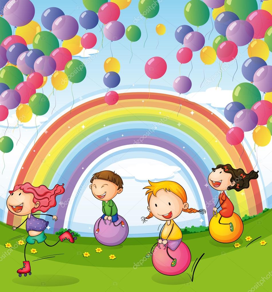 Kids playing with floating balloons and rainbow in the sky