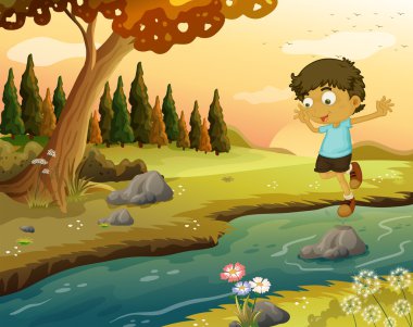 A boy playing at the flowing water clipart