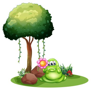 ağacın yanında çiçek ayakta tutan bir canavar