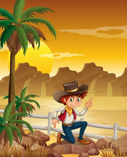Ein junger Cowboy in der Wüste nahe den Felsen — Stockvektor