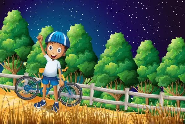 一个快乐的男孩的自行车站在栅栏附近树林 — 图库矢量图片