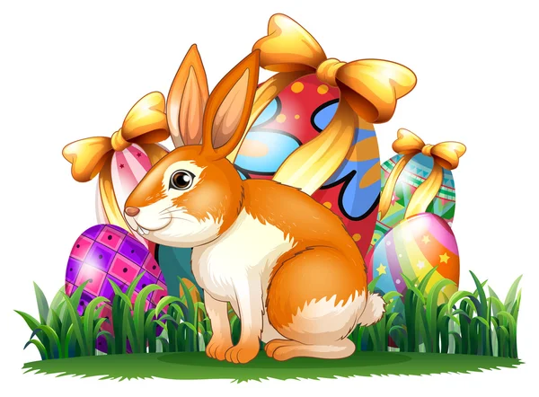 Um coelho bonito na frente dos ovos de Páscoa — Vetor de Stock