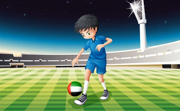 Um menino chutando a bola com a bandeira dos Emirados Árabes Unidos — Vetor de Stock
