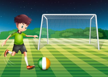 İrlanda bayrağı ile topu tekmelemek bir futbolcu