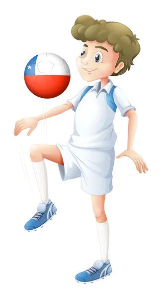 Un ragazzo che usa la palla con la bandiera del Cile — Vettoriale Stock