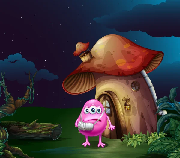 Un monstruo rosa herido cerca de la casa de hongos — Vector de stock