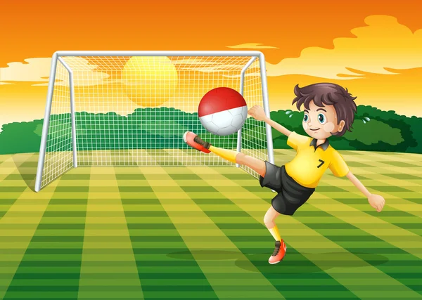A player kicking the ball with the flag of Indonesia — Stock Vector