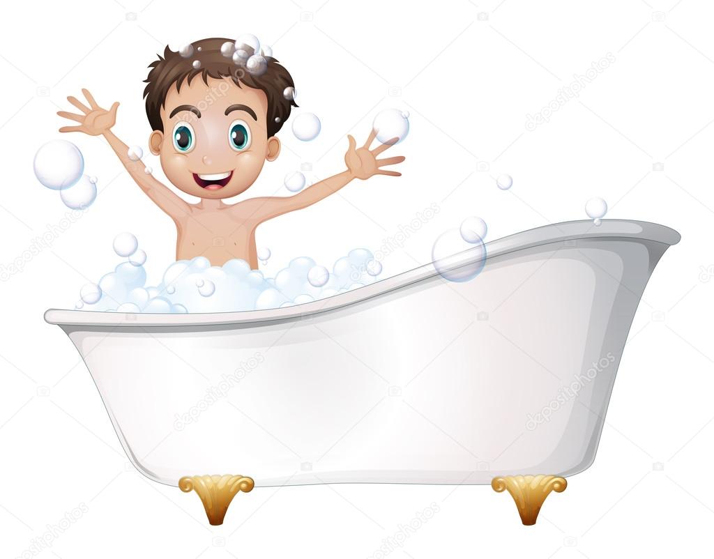 A little boy at the bathtub