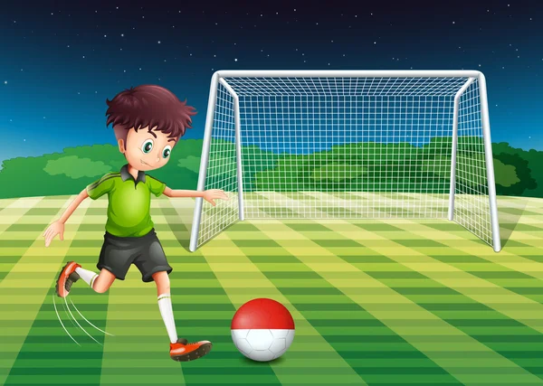 Un jugador pateando la pelota con la bandera de Indonesia — Vector de stock