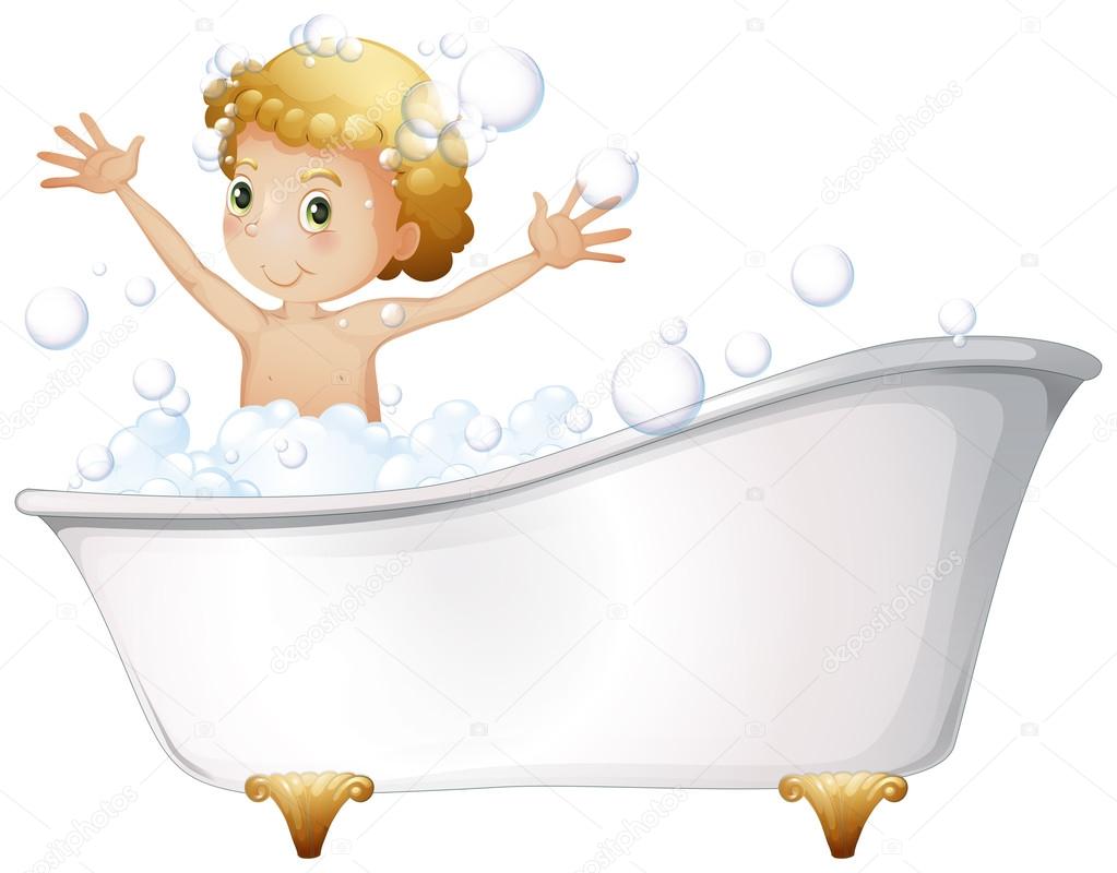 A young boy taking a bath at the bathtub