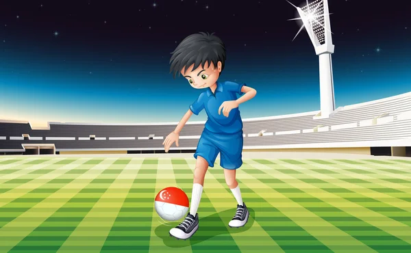 A boy at the field using the ball with the flag of Singapore — Stock Vector