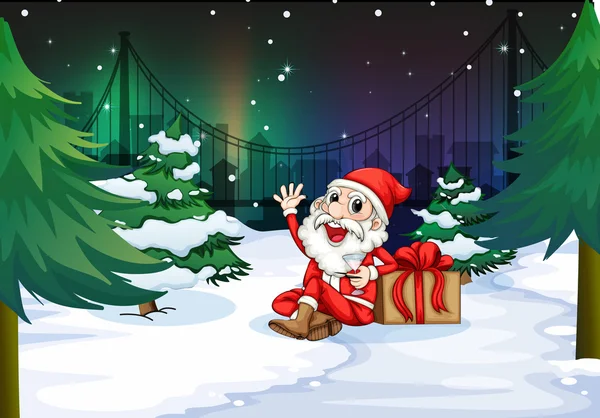 A smiling Santa beside the gift — Stock Vector