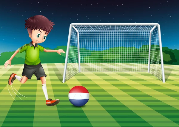 Een mannelijke speler schoppen de bal met de vlag van Nederland — Stockvector