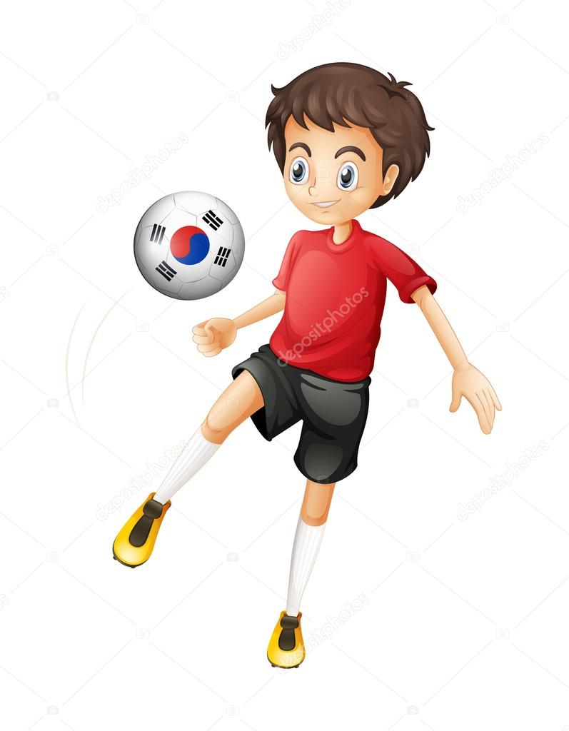A smiling boy playing the ball with the flag of South Korea
