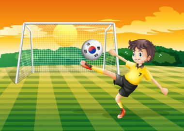 Güney Kore bayrağı ile topu kullanarak bir futbolcu