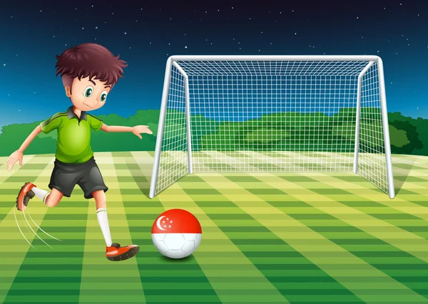 A boy at the field using the ball with the Singaporean flag — Stock Vector