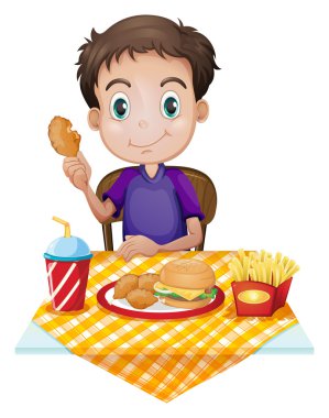 genç bir çocuk bir fastfood restoranda yemek