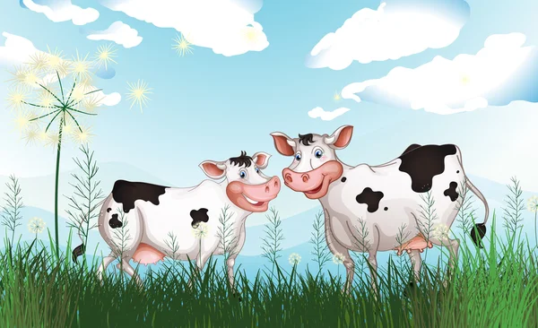 Dos vacas en el pastizal — Vector de stock