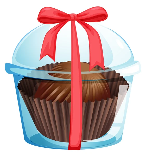 Um cupcake dentro de um recipiente com uma fita vermelha — Vetor de Stock