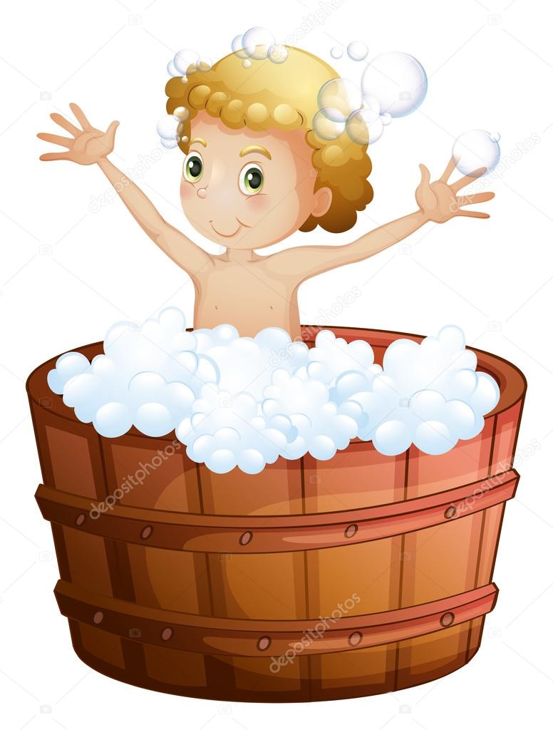 A young boy taking a bath
