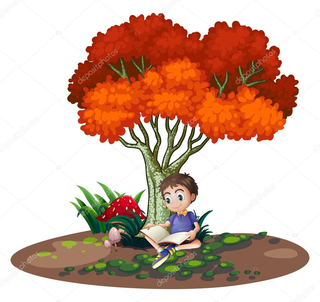 A boy reading under the tree