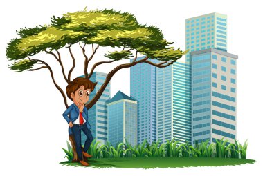 yüksek binalar arasında ağacın altında bir adam