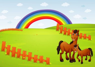 Çayırda duran çiftlik hayvanları.