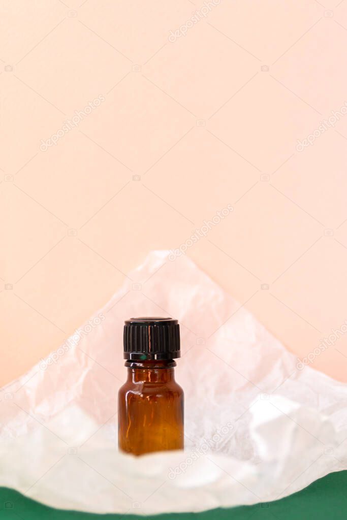 Aroma oil glass bottle with torn paper, skin care products
