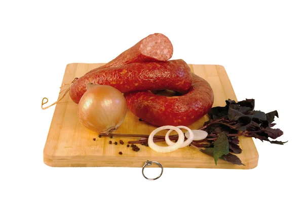 Round smoked sausages on a wooden board — Stock Photo, Image