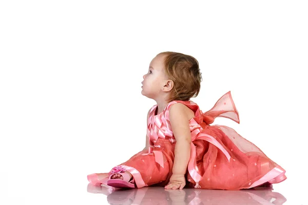 Baby im eleganten rosa Kleid — Stockfoto